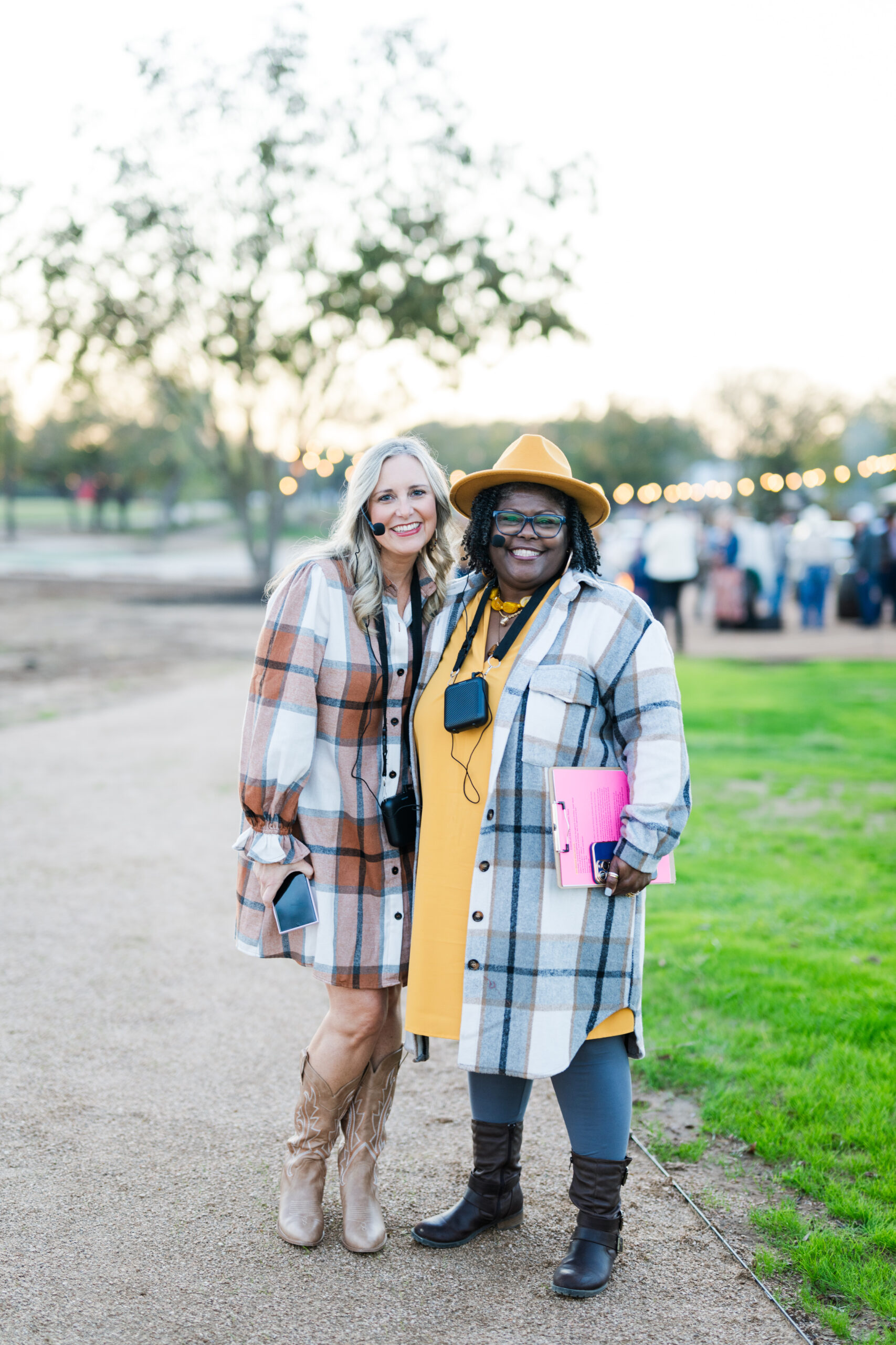 two ladies posing for picture